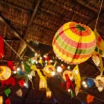Traditional flags and lanterns of June festivities in northeastern Brazil. Background colorful.